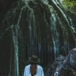 woman gazing at waterfalls