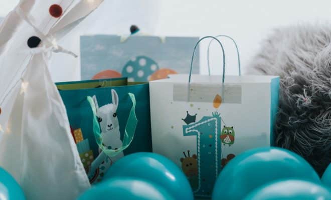 green and white snowman print paper bag